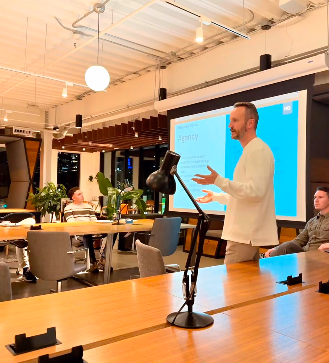 HQ team presenting at a client meeting